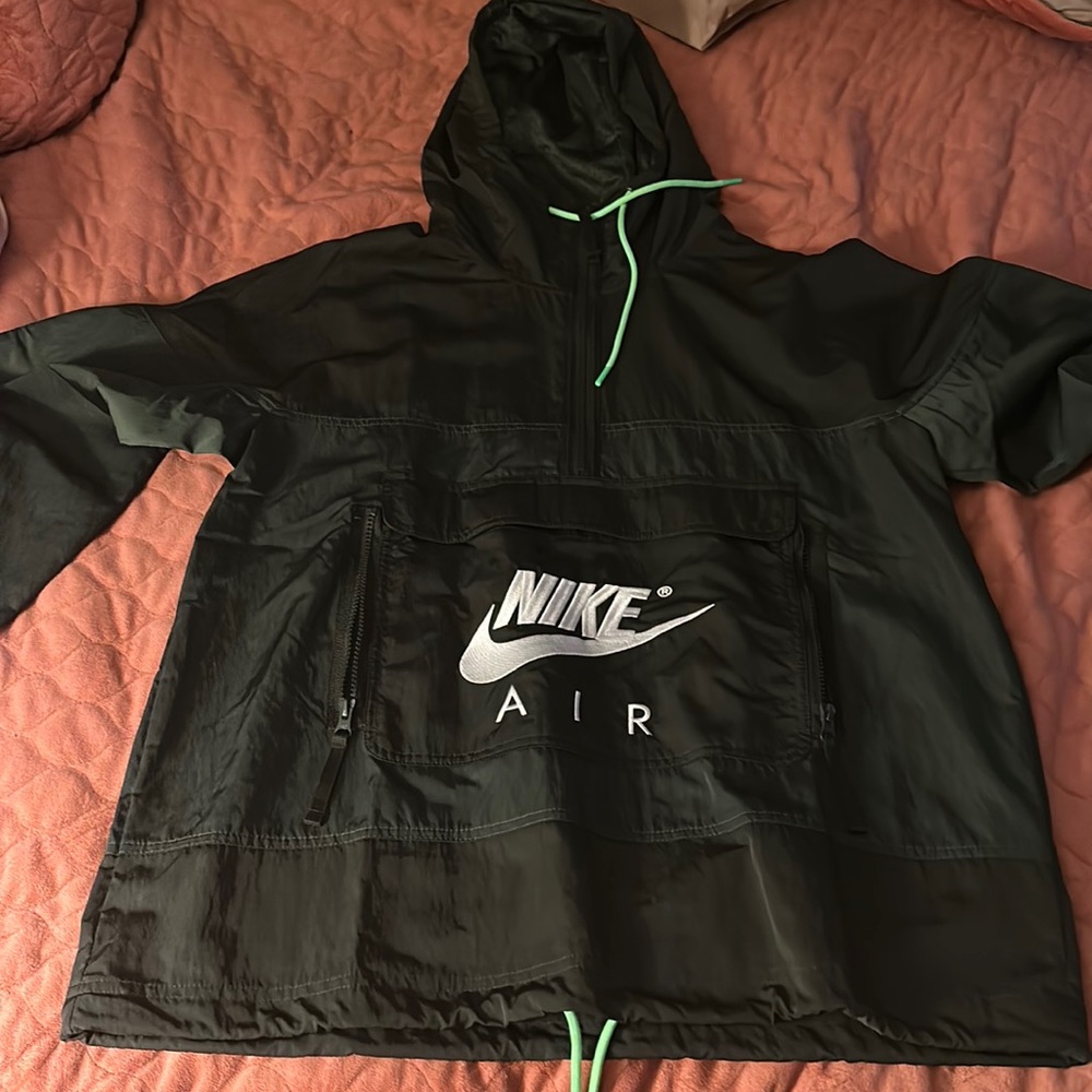 Green Nike windbreaker/raincoat.